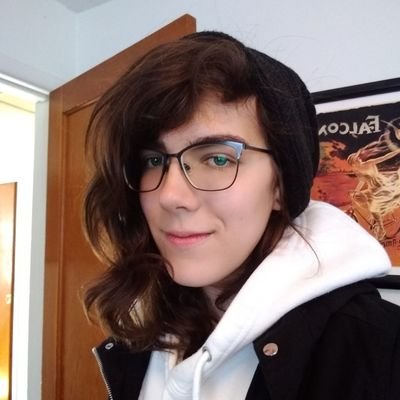 A casual picture of Freya LaLuna in a white hoodie and a black beanie.